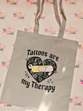 Grey cotton tote bag with black Tattoos are my Therapy design and colourful plaster heart