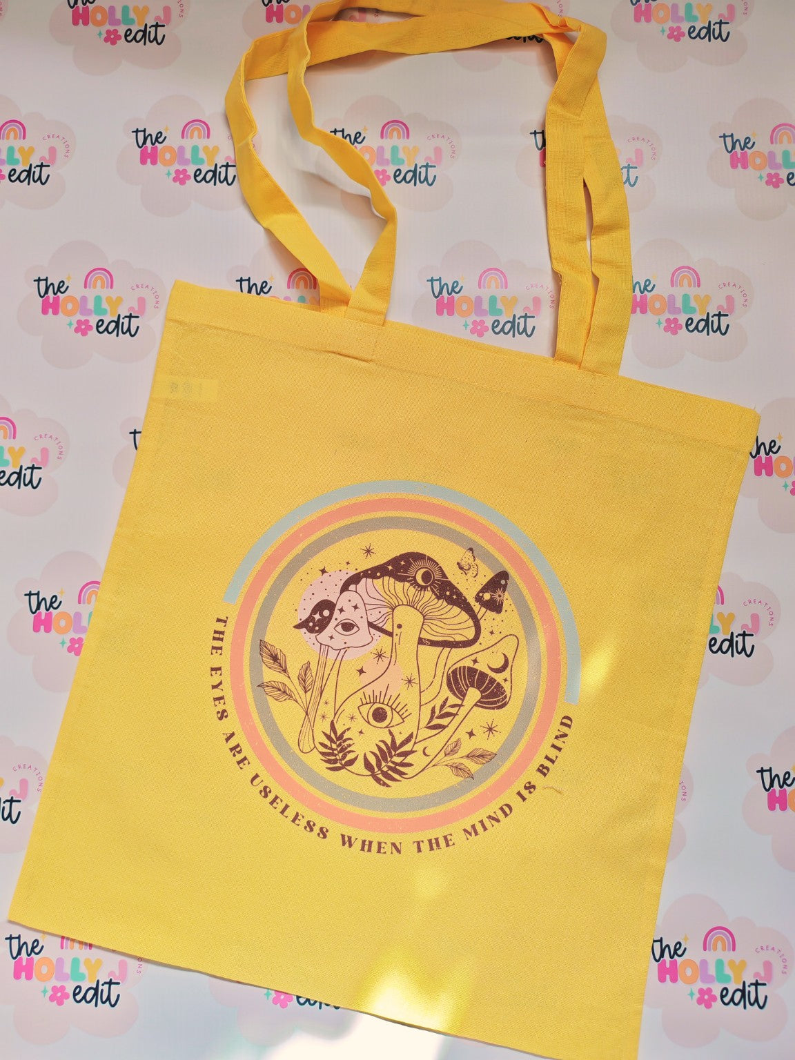 Yellow cotton tote bag with colourful rainbow mushroom and celestial design