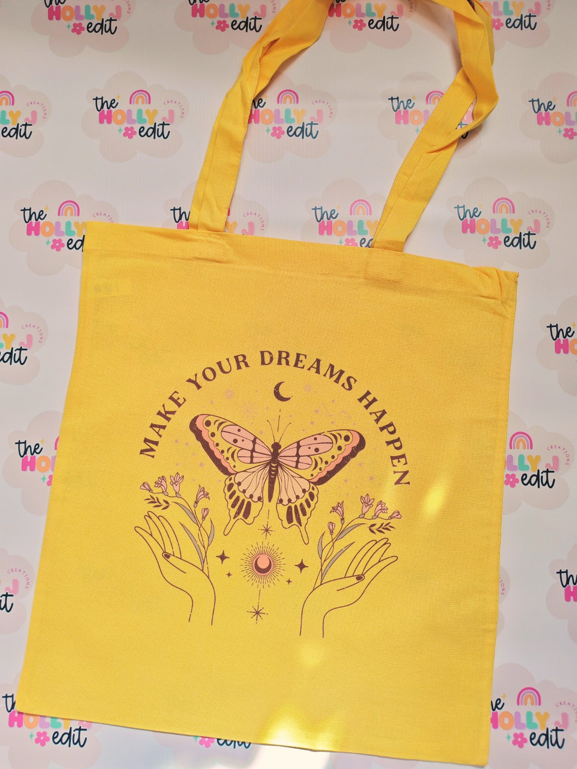 Yellow cotton tote bag with butterfly and Make Your Dreams Happen celestial design