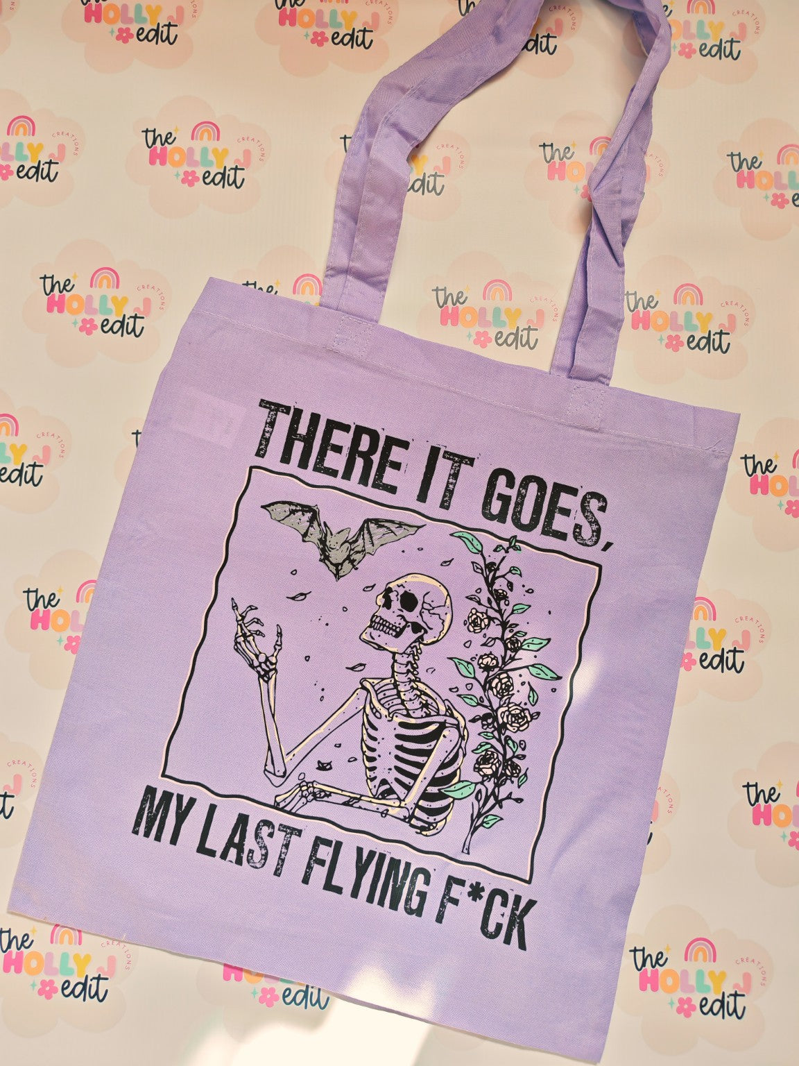 Lilac cotton tote bag with skeleton and There It Goes My Last Flying F*ck design