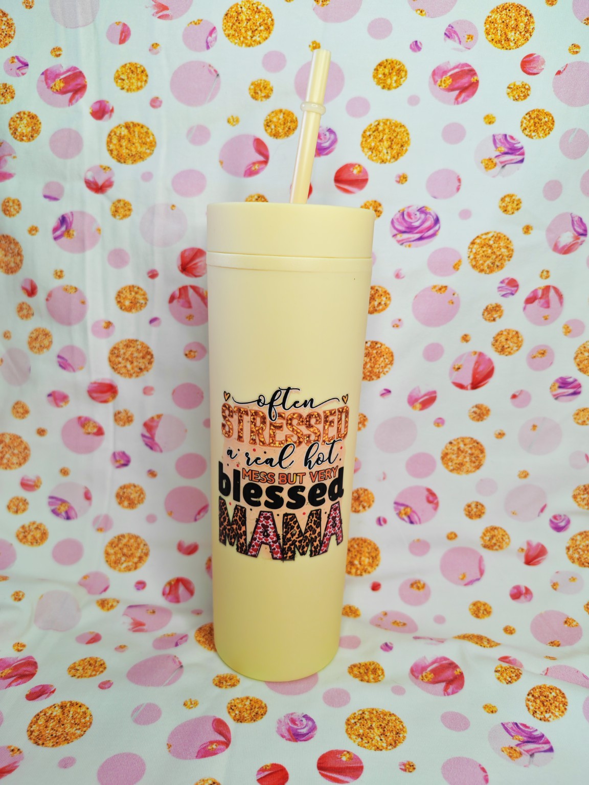 Cream 16oz skinny tumbler with Often Stressed Blessed Mama design and straw
