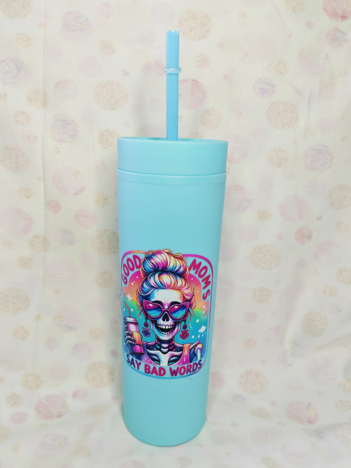 Light blue 16oz skinny tumbler with colourful Good Moms Say Bad Words skeleton design