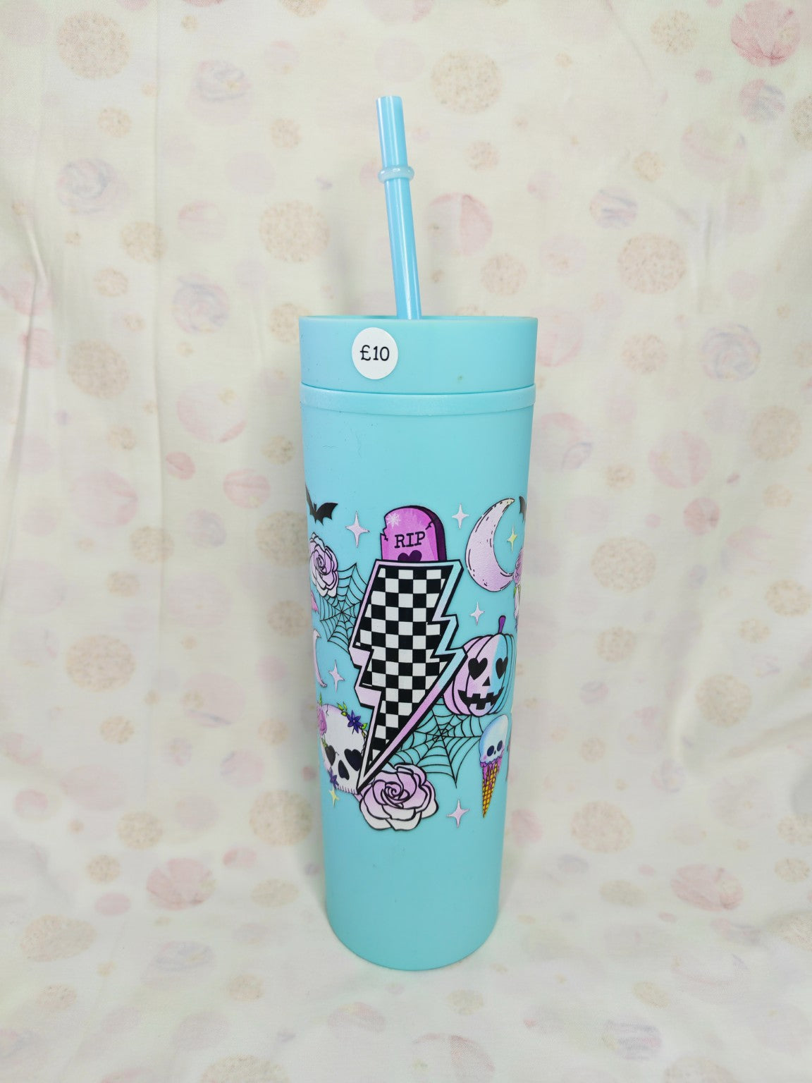 Light blue 16oz skinny tumbler with colourful Halloween checkerboard lightning bolt design