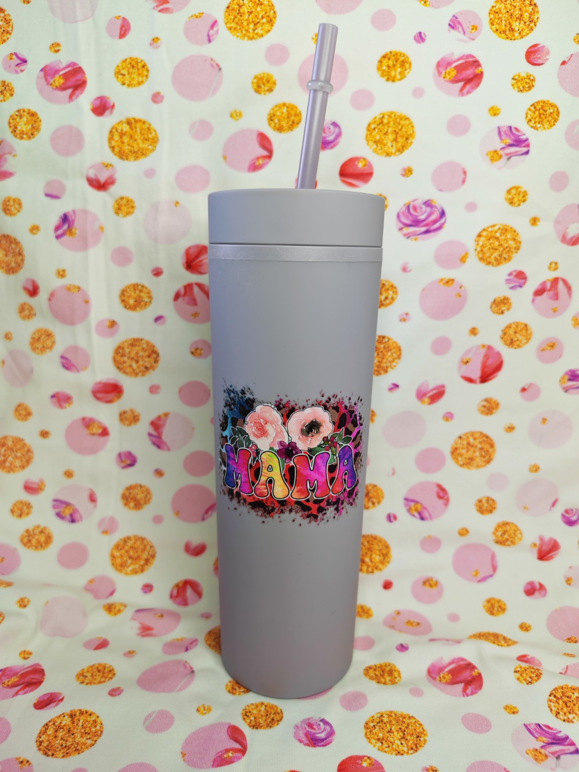 Grey 16oz skinny tumbler with colourful Mama floral design and straw