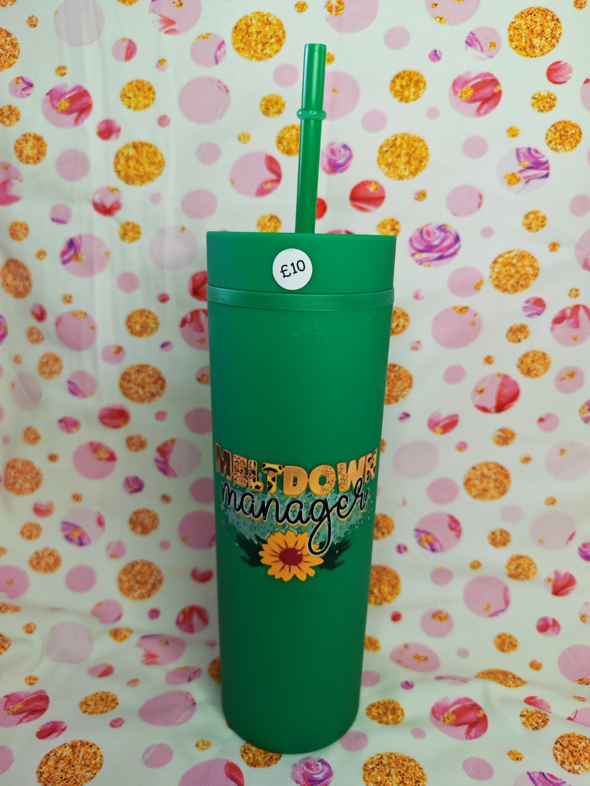 Green 16oz skinny tumbler with Meltdown Manager design and sunflower