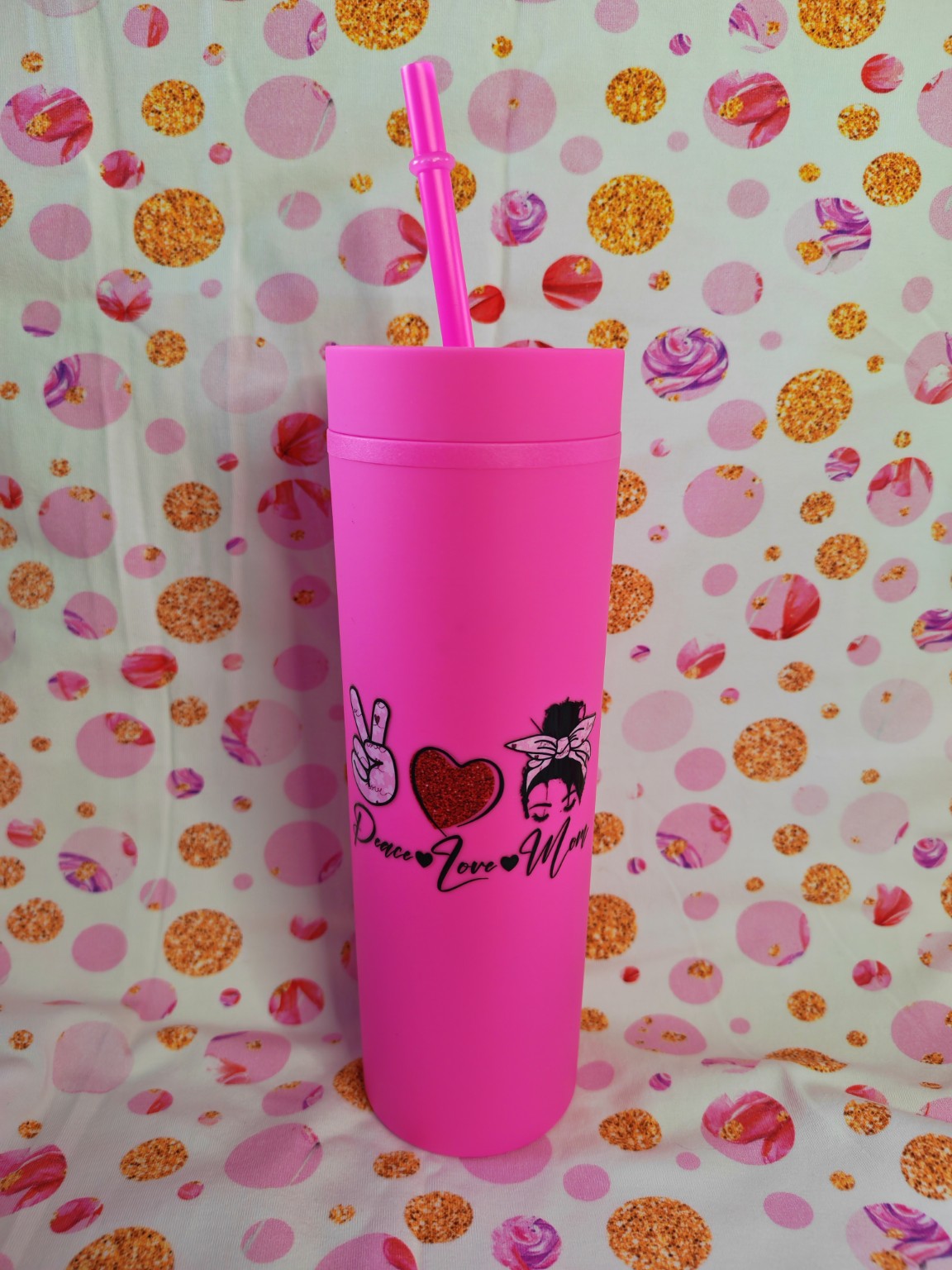 Bright pink 16oz skinny tumbler with Peace Love Mum design and straw