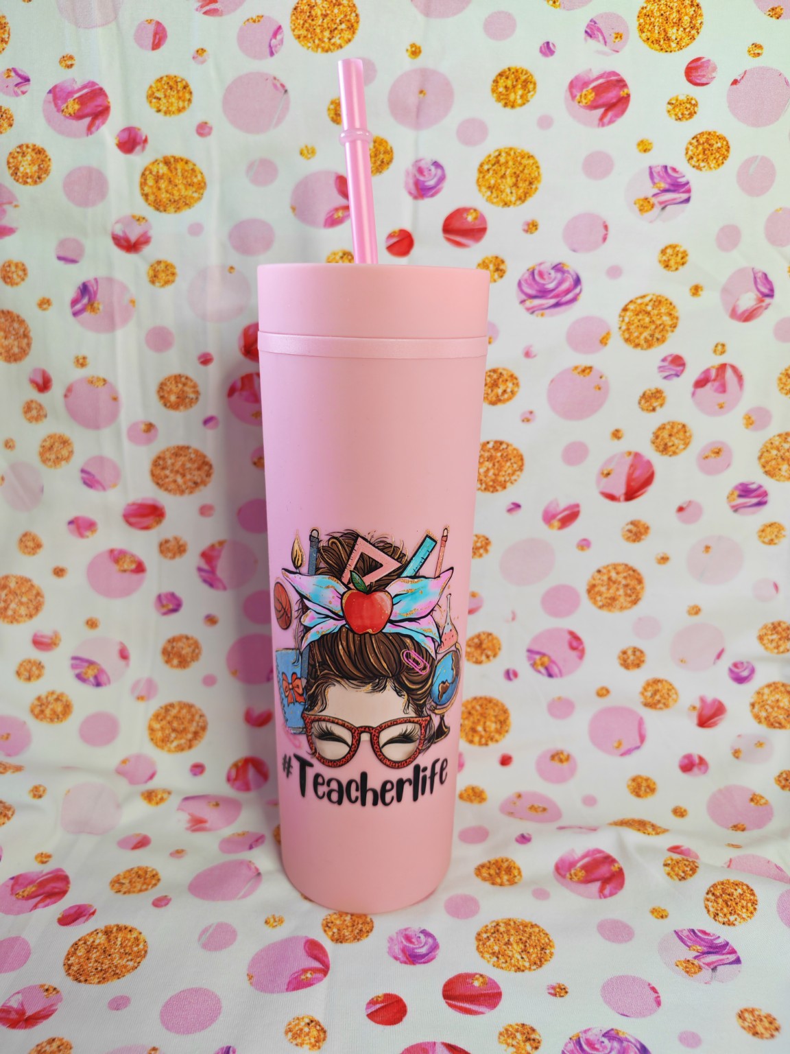 Pink 16oz skinny tumbler with Teacher Life design and straw