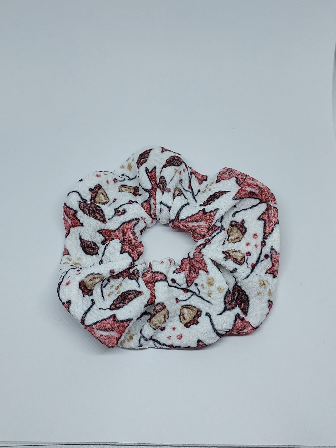 Handmade white scrunchie with autumn leaf print