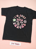 Black children's T-shirt with pastel floral I'm just here for the snacks design, size 3-4 years