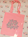 Pink tote bag with Books Are My Therapy design
