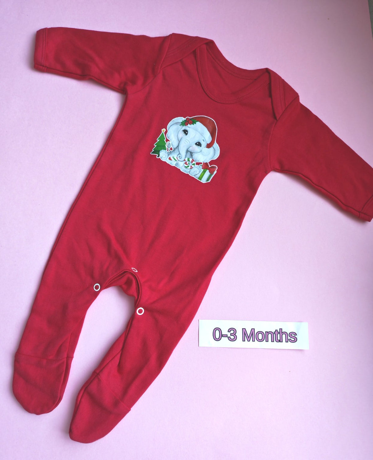 Red long sleeve baby romper with feet and popper crotch, Christmas elephant design, size 0-3 months