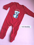 Red long sleeve baby romper with feet and popper crotch, Christmas penguin design, size 0-3 months