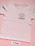 Pale pink children's T-shirt with Cute Smart and a Little Bit Dramatic daisy design, front, size 8 years