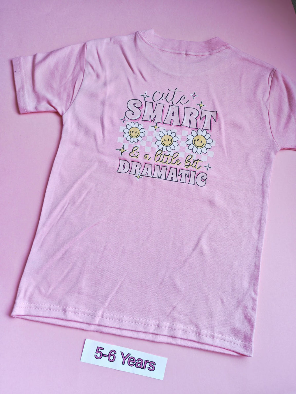 Pink children's t-shirt with Cute Smart and a Little Bit Dramatic daisy design on the back, 5-6 years