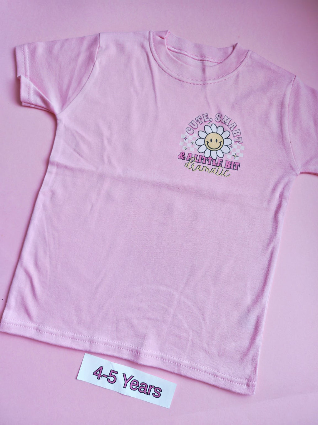 Pink children's t-shirt, 4-5 years, cute smart and a little bit dramatic daisy design, front view