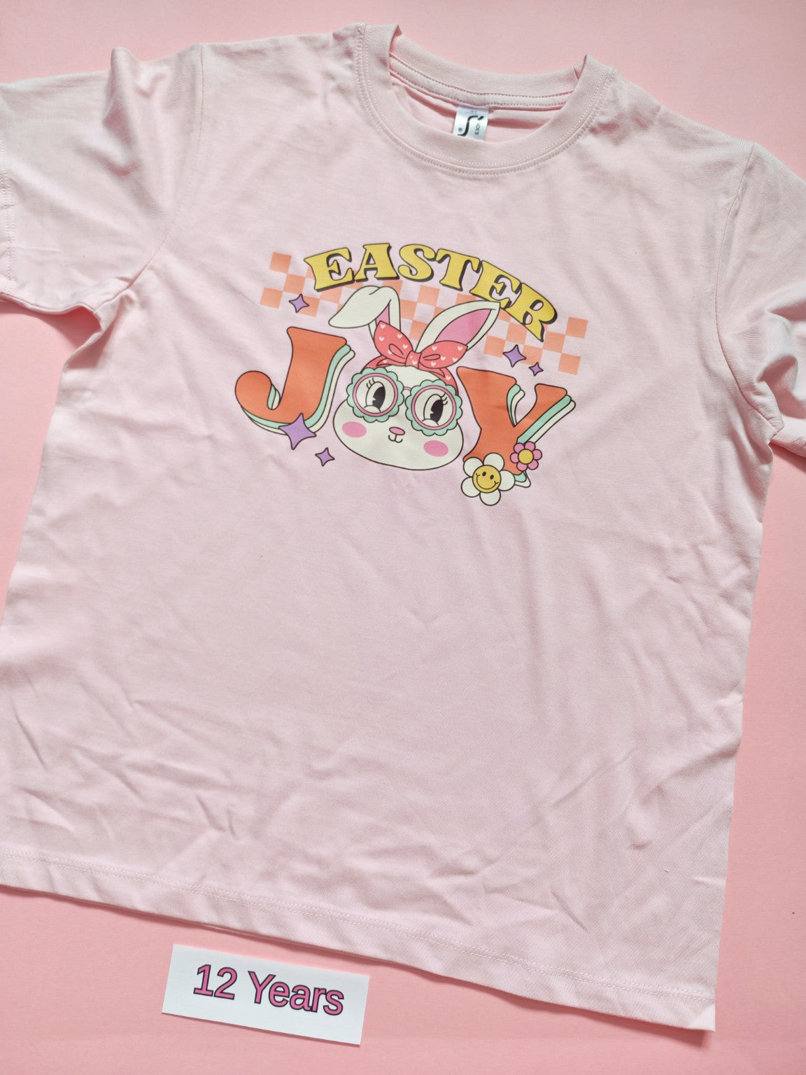 Pale pink children's Easter T-shirt with cute bunny design, size 12 years