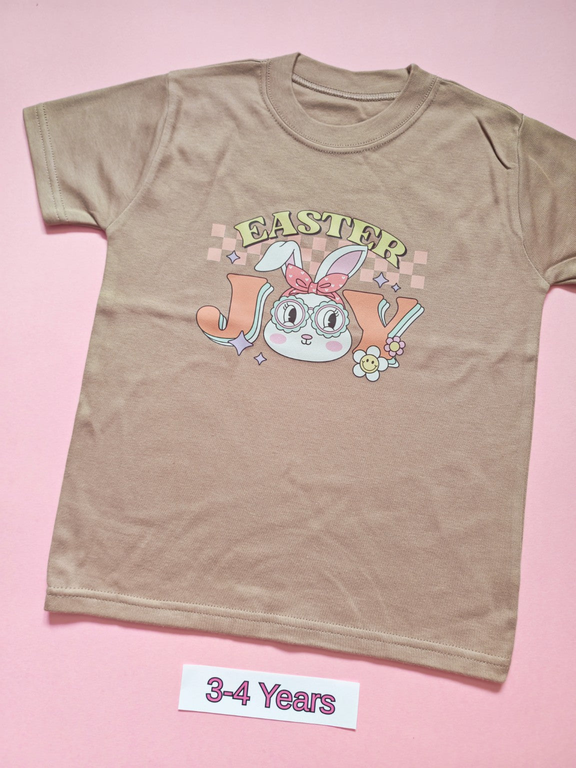 Taupe children's T-shirt with pastel Easter Joy bunny design, size 3-4 years