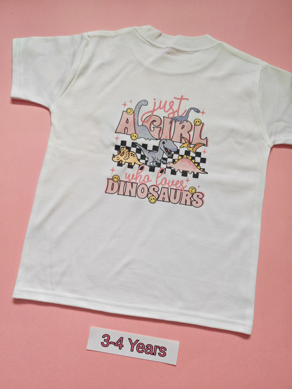 White children's T-shirt with Just A Girl Who Loves Dinosaurs design, size 3-4 years, back