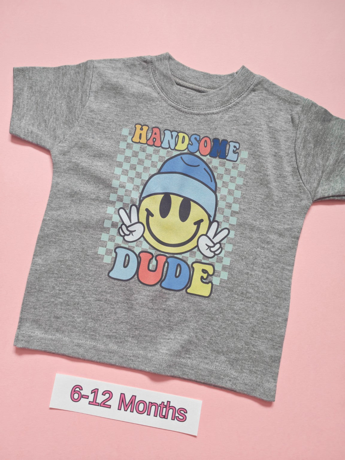 Grey children's T-shirt with colourful Handsome Dude smiley face design, size 6-12 months