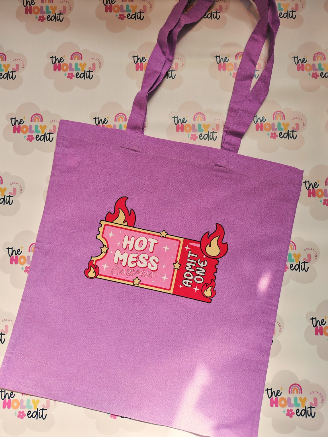 Purple cotton tote bag with Hot Mess Express Admit One ticket design