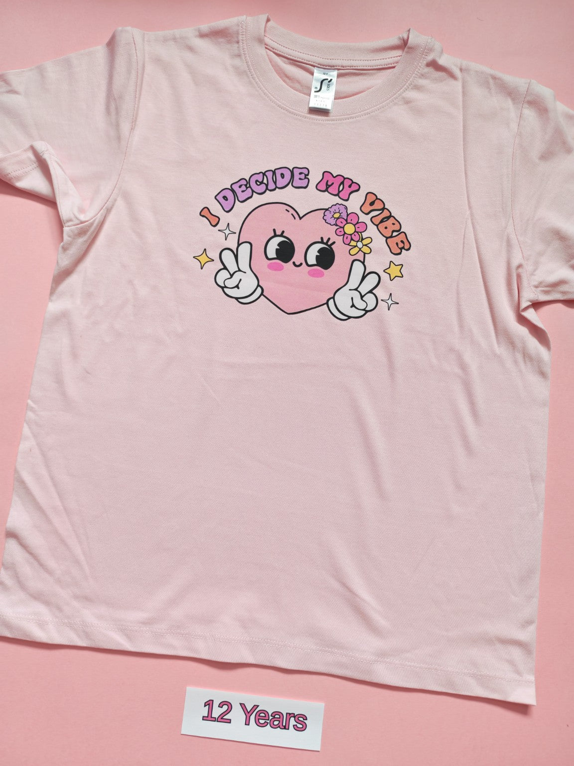 Pink children's T-shirt with I Decide My Vibe design, size 12 years