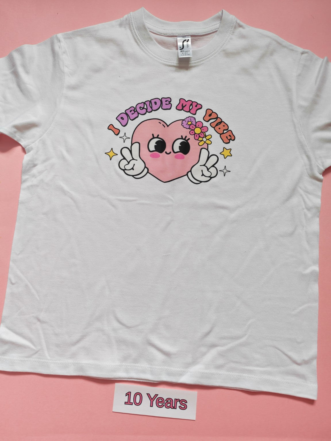 White children's T-shirt with I Decide My Vibe heart design, size 10 years