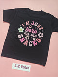 Black children's T-shirt with colourful flowers and I'm just here for the snacks slogan, size 1-2 years