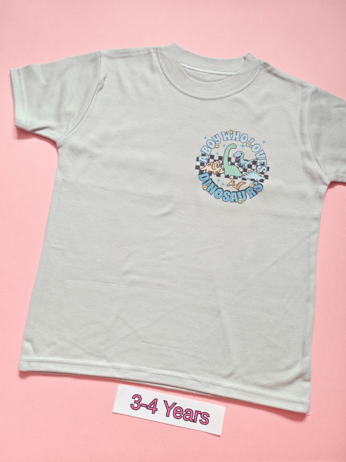 White children's T-shirt with Just a Boy Who Loves Dinosaurs design, size 3-4 years, front