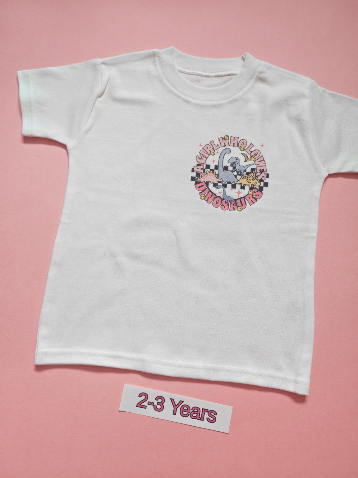 White children's dinosaur T-shirt with pink Just a Boy Who Loves Dinosaurs design, size 2-3 years, front