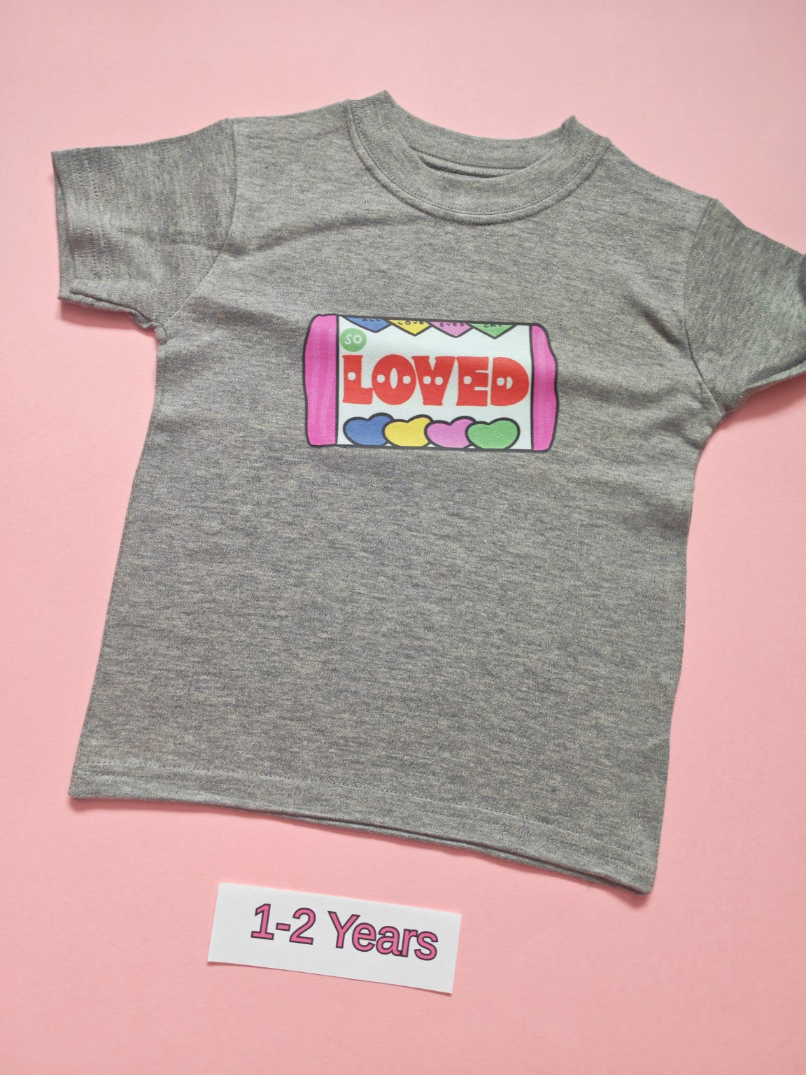 Grey children's T-shirt with colourful candy tube Loved design, size 1-2 years