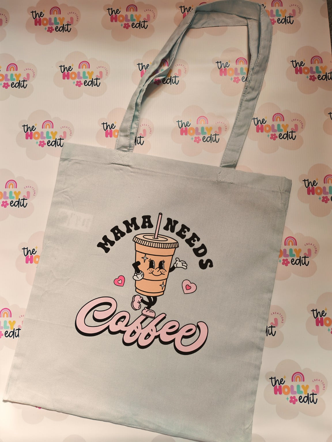 White cotton tote bag with Mama Needs Coffee design