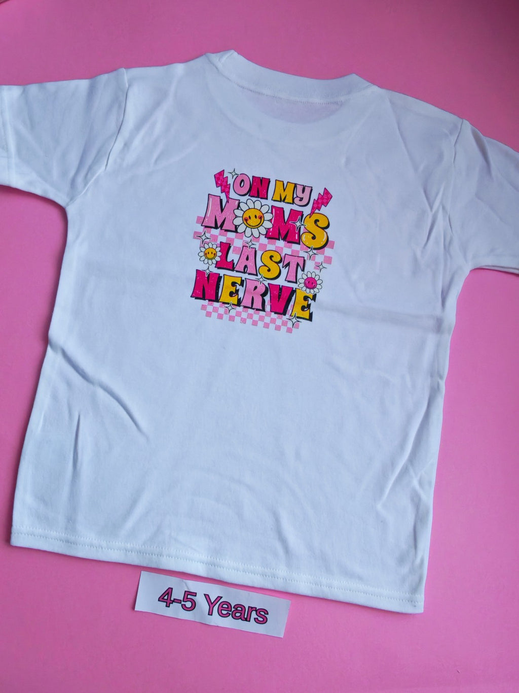 White children's t-shirt with colourful On My Mum's Last Nerve design on the back, 4-5 years