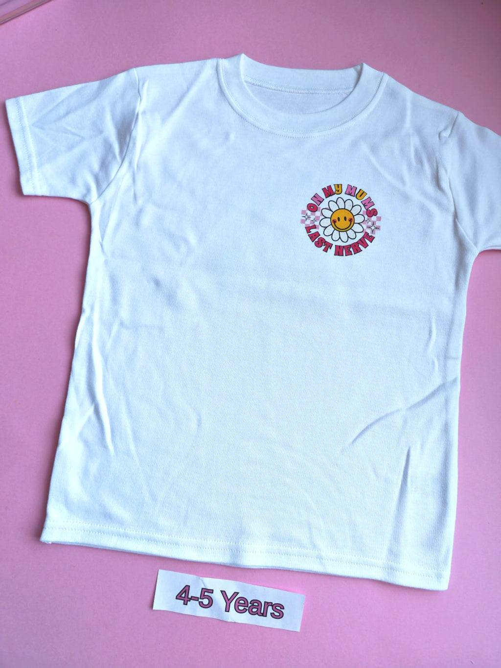 White children's t-shirt with colourful On My Mum's Last Nerve daisy design, 4-5 years, front
