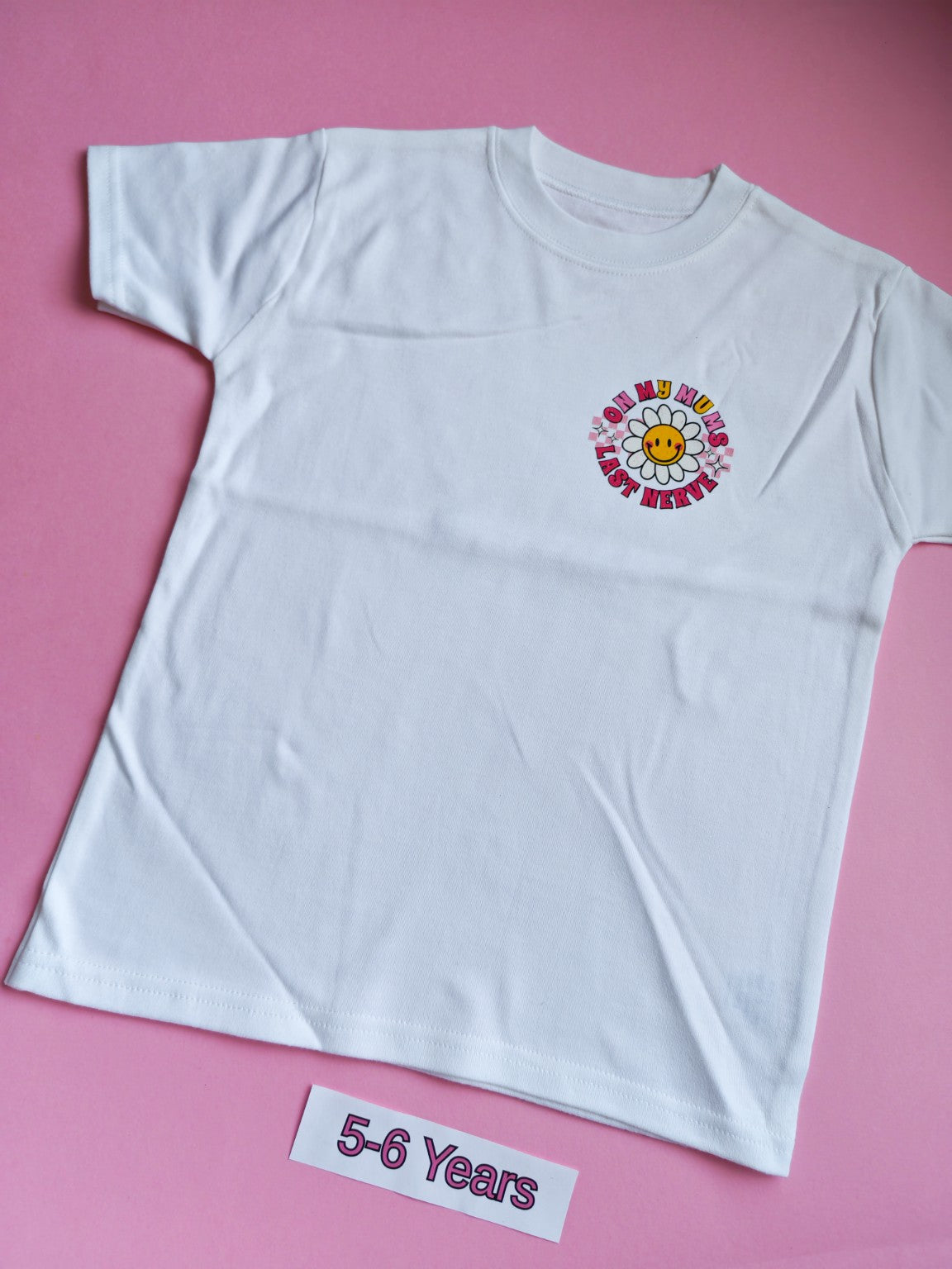 White children's t-shirt with colourful On My Mum's Last Nerve daisy design, 5-6 years, front