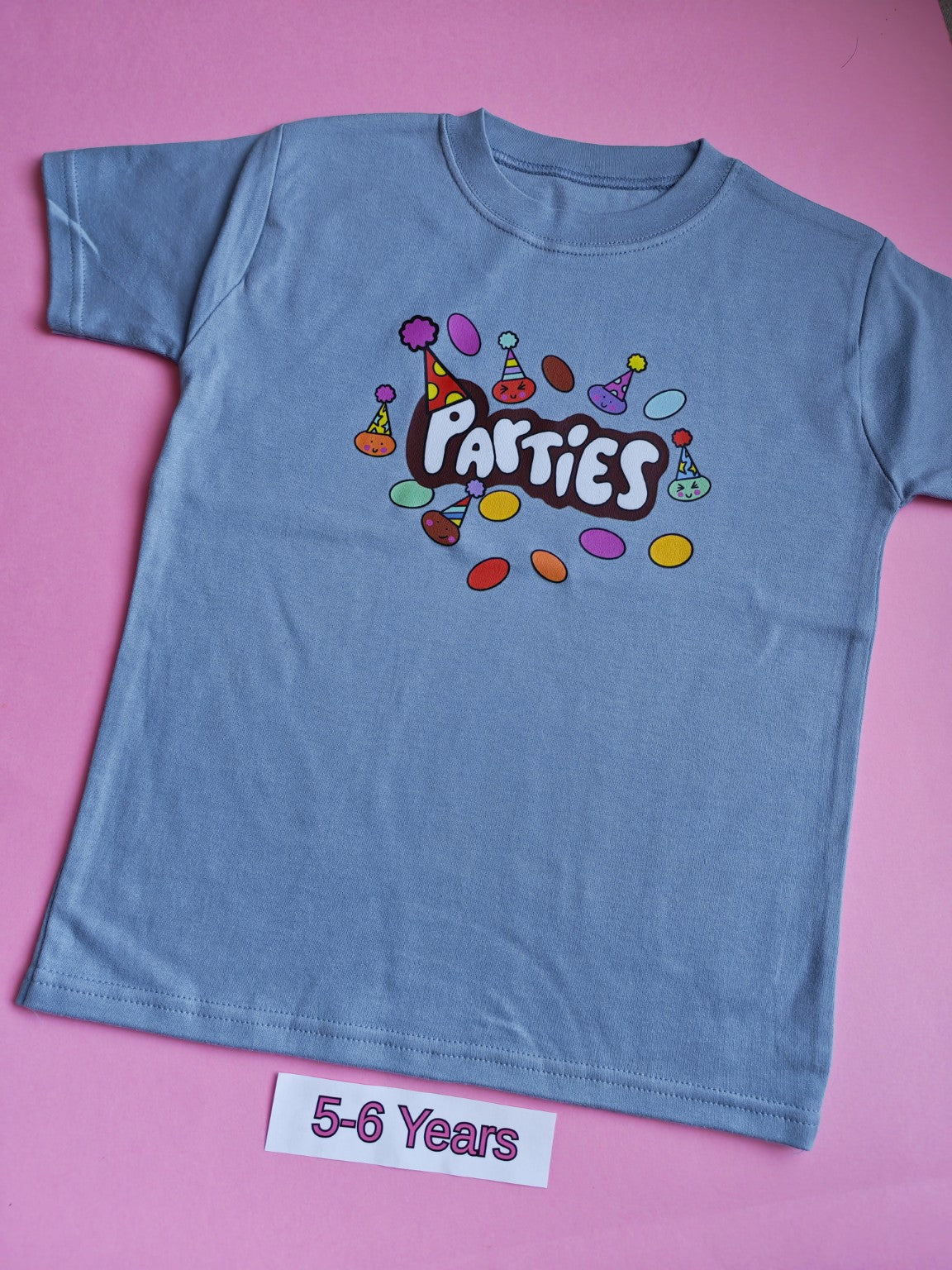 Blue children's t-shirt with colourful Parties design, size 5-6 years