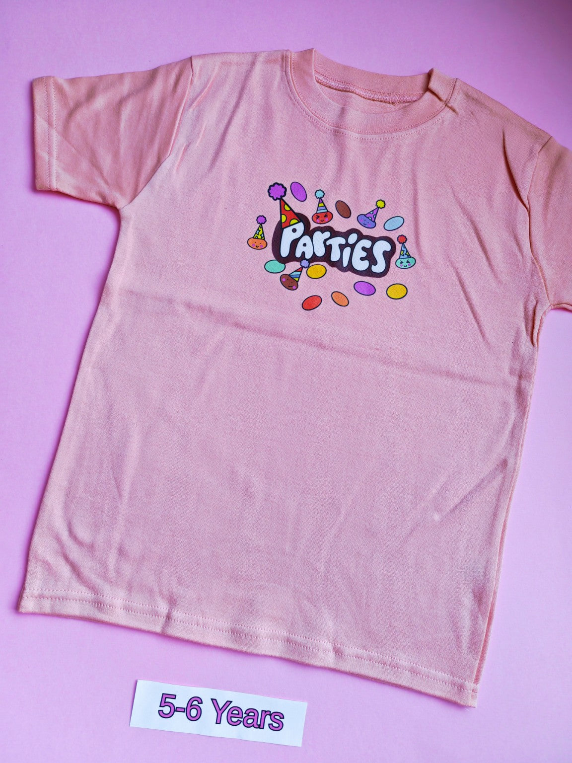 Peach children's t-shirt with colourful Parties design, 5-6 years