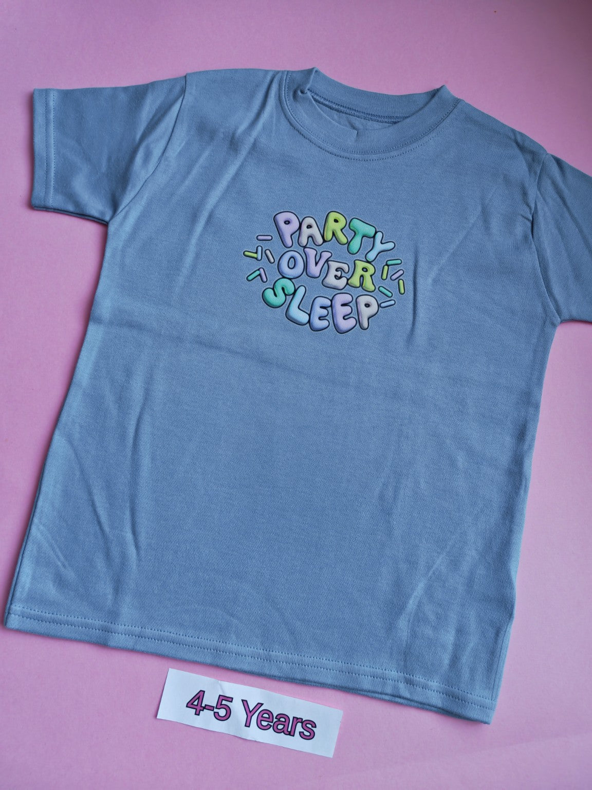 Blue children's t-shirt with colourful Party Over Sleep design, size 4-5 years
