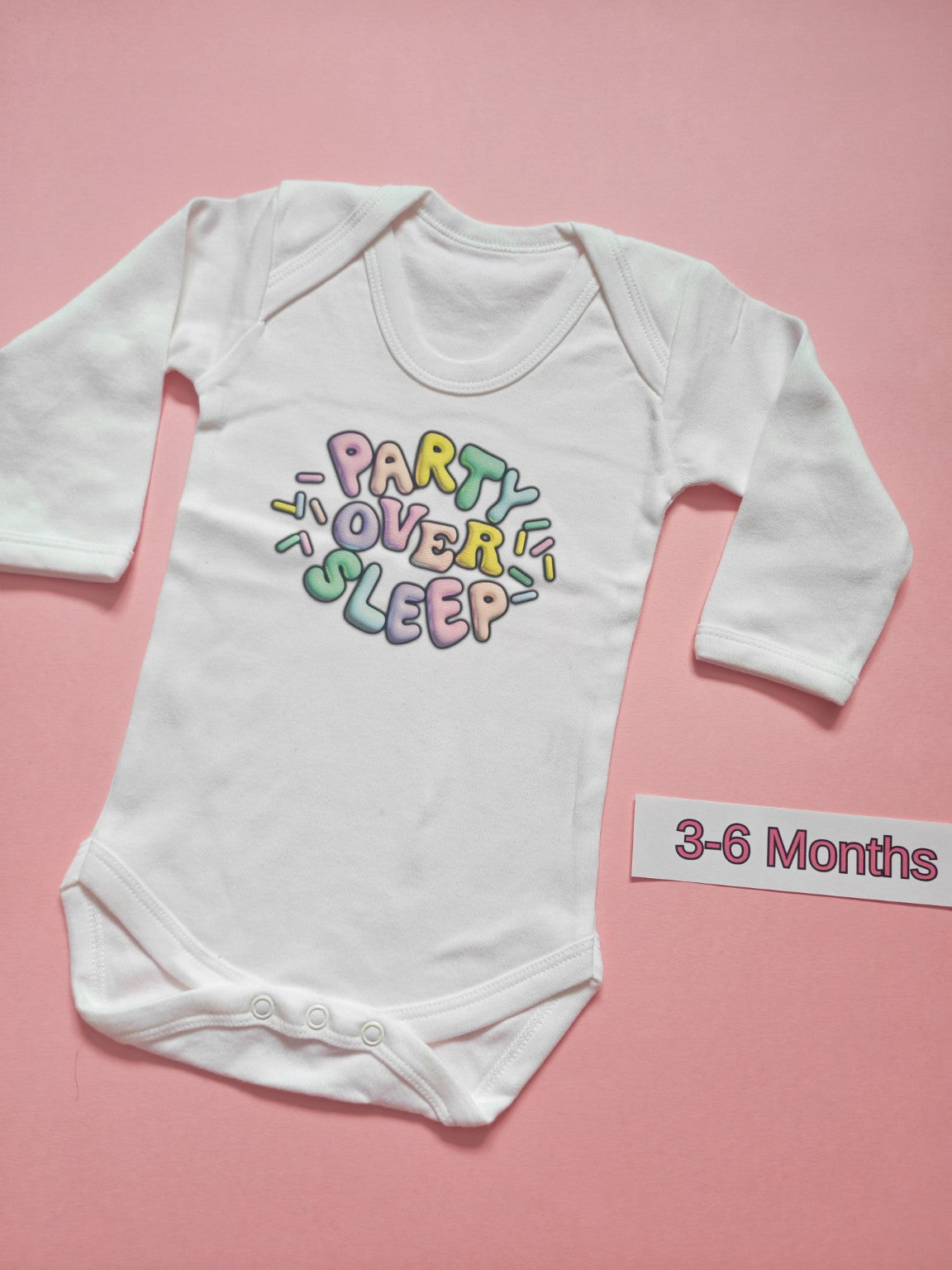 White long sleeve baby bodysuit with colourful Party Over Sleep design, size 3-6 months