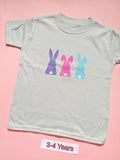 White children's T-shirt with three pastel bunny silhouettes, size 3-4 years