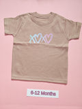 Taupe children's T-shirt with pastel blue and pink heart design, size 6-12 months
