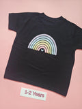 Black children's T-shirt with pastel rainbow design, size 1-2 years