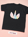 Black children's T-shirt with pastel rainbow unicorn horn and flower design, size 3-4 years