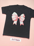 Black children's T-shirt with large pink bow design, size 2-3 years