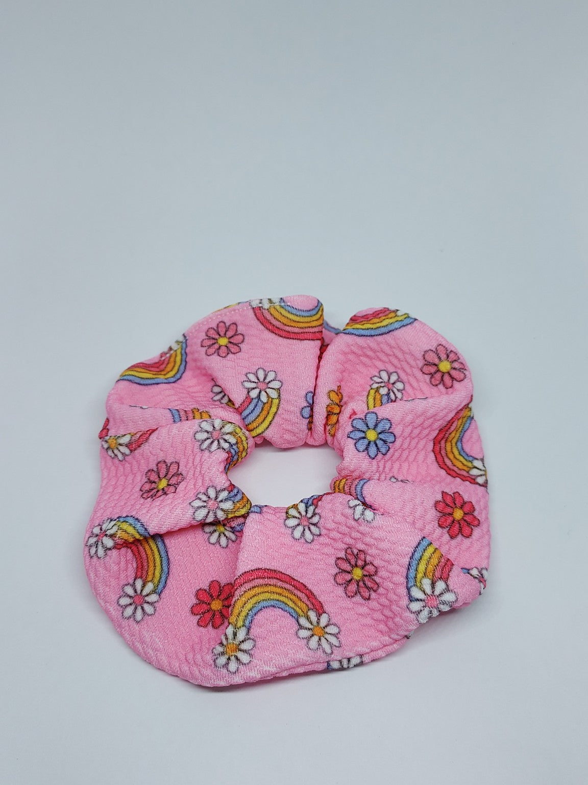 Pink handmade scrunchie with rainbow and daisy print