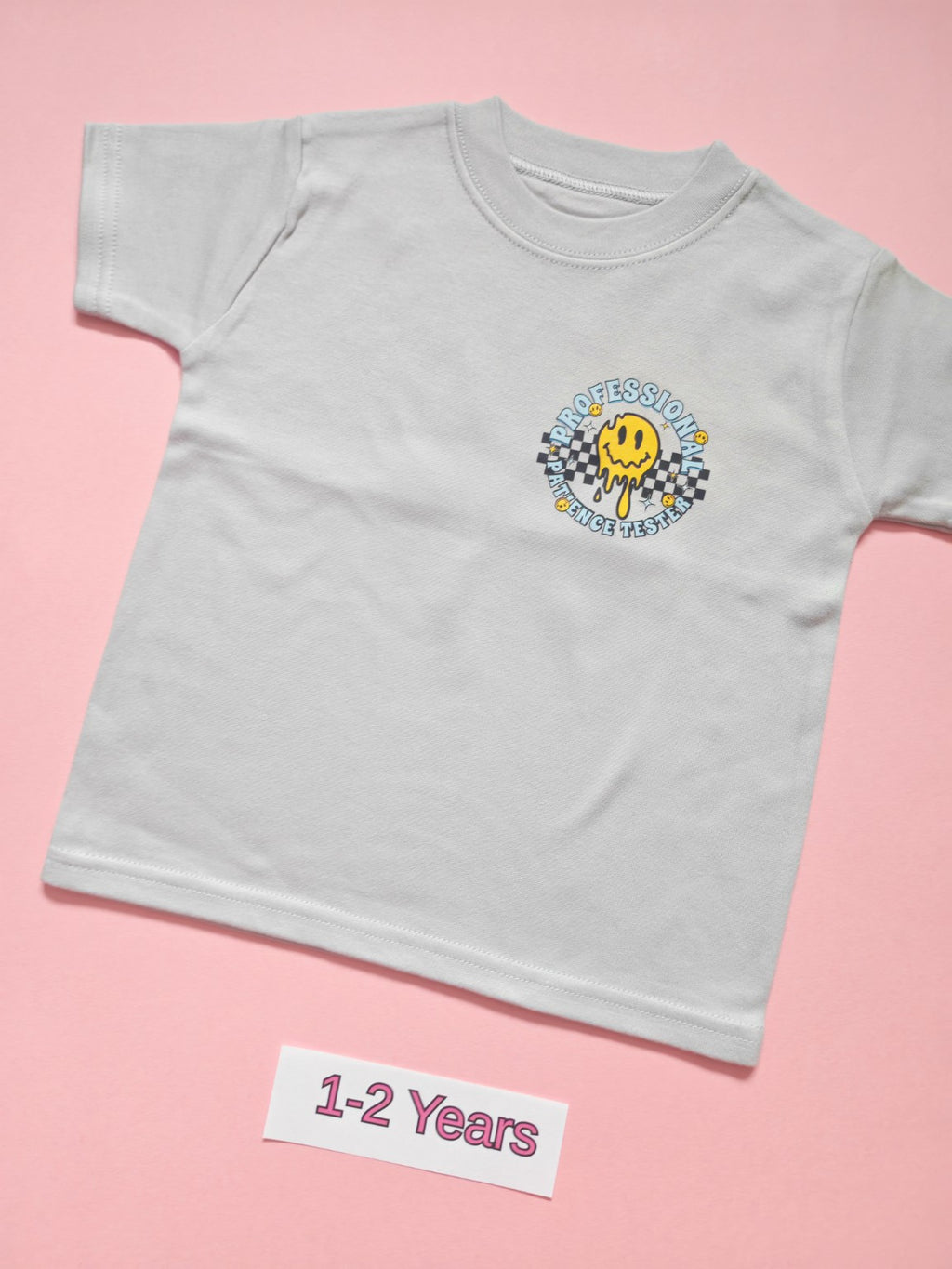 Frozen Grey children's T-shirt with Professional Patience Tester smiley design, size 1-2 years, front