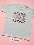 White children's T-shirt with pink Professional Patience Tester checkerboard design, size 3-4 years