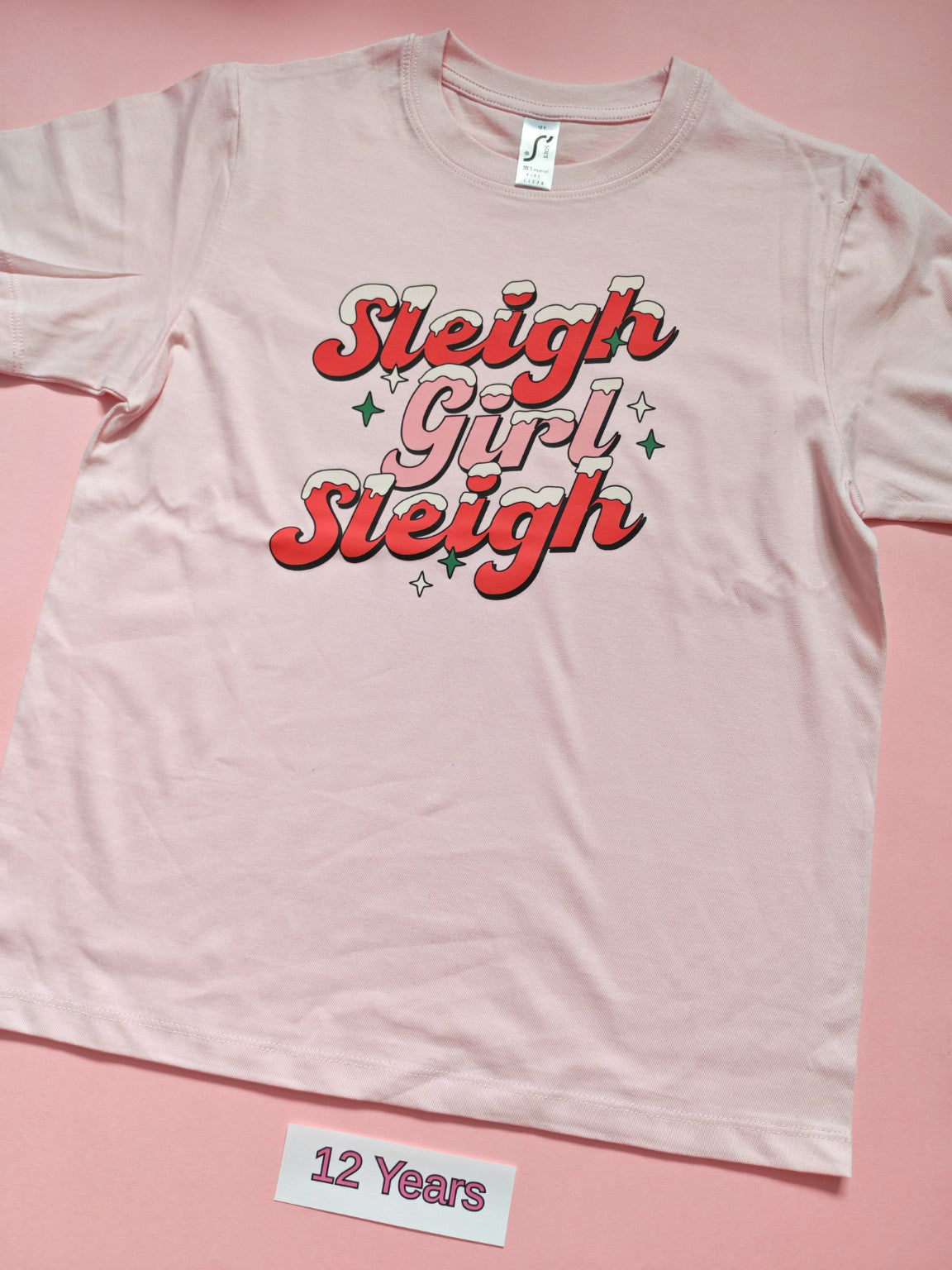 Pink children's Christmas t-shirt with Sleigh Girl Sleigh design, size 12 years
