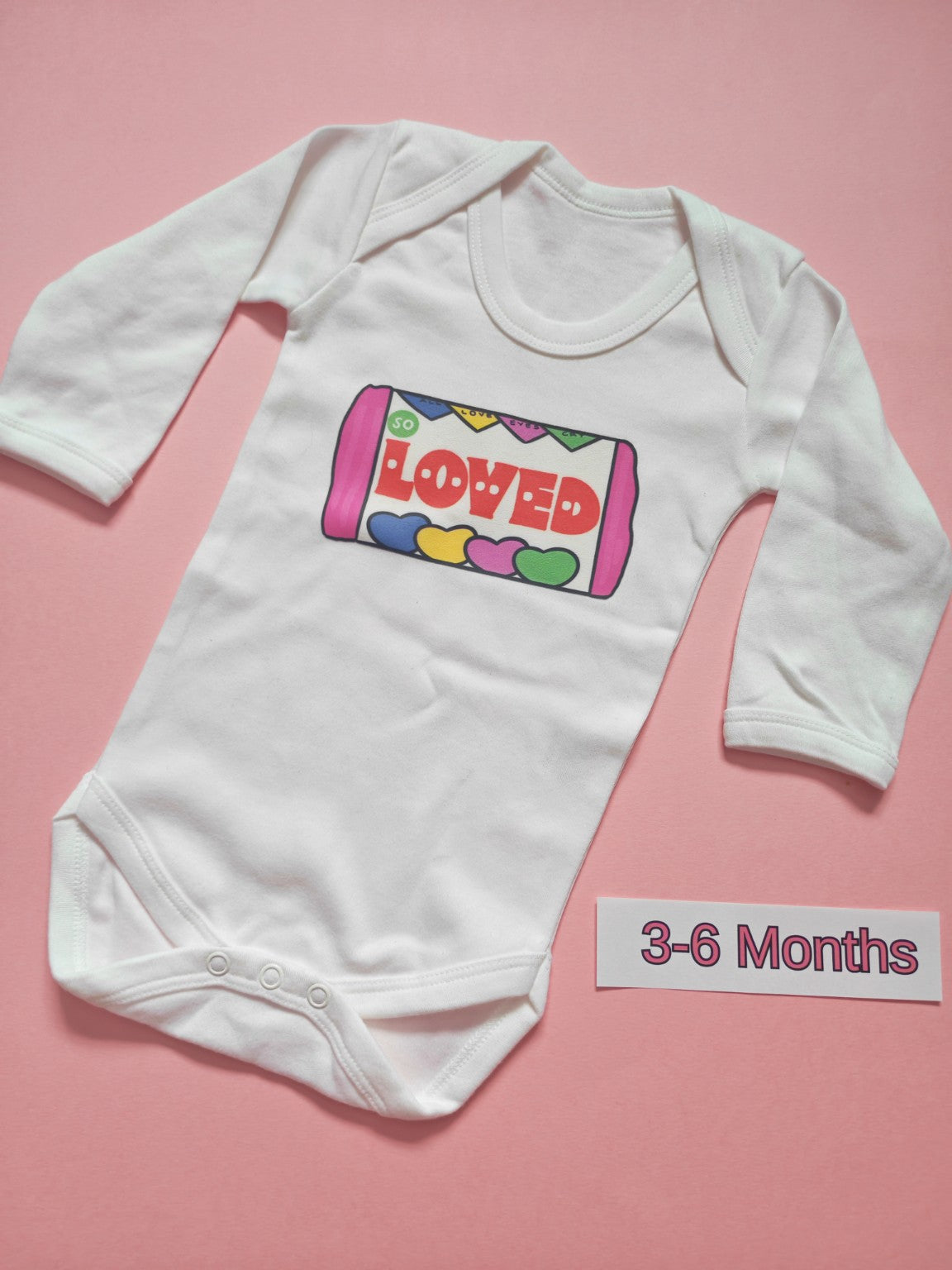 White long sleeve baby bodysuit with colourful So Loved design, size 3-6 months