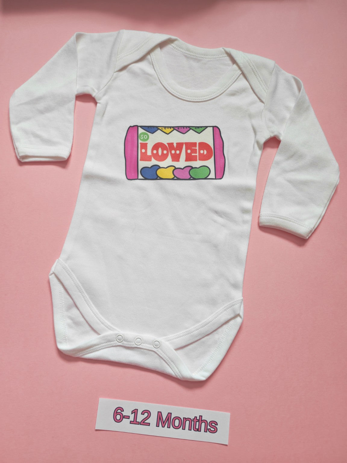 White long sleeve baby bodysuit with colourful So Loved design, size 6-12 months