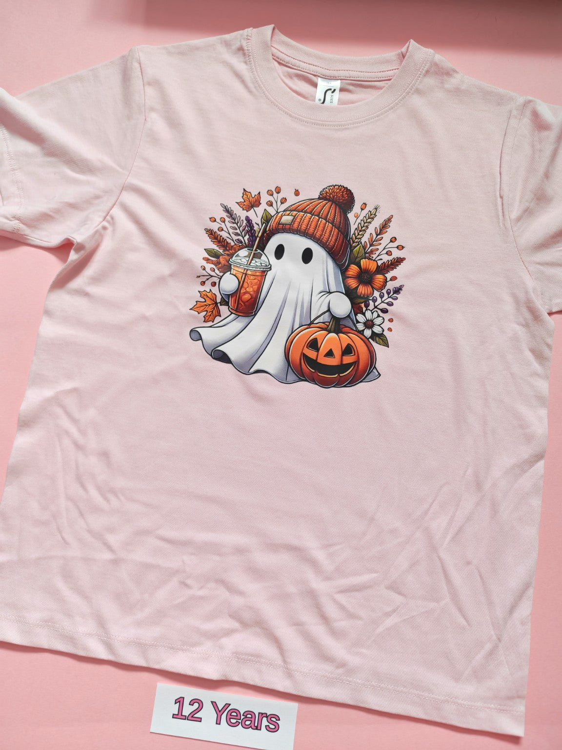 Pale pink children's Halloween T-shirt with cute ghost and pumpkin design, size 12 years